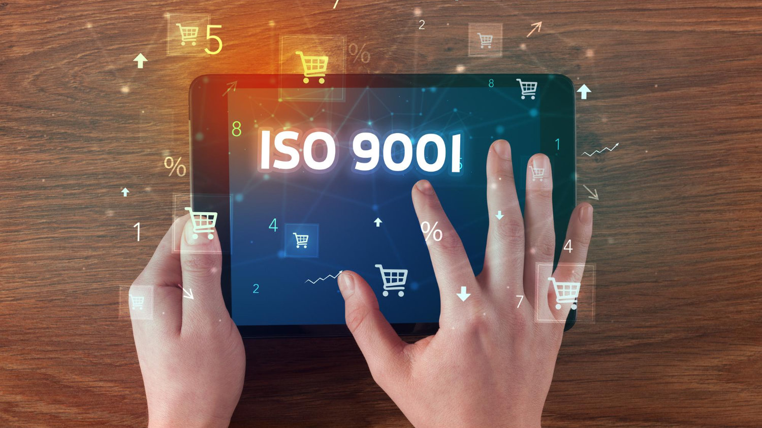 ISO9001 depicted on a tablet screen with a hand hovering over it